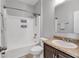 Well-lit bathroom features a shower-tub combo with modern fixtures and neutral finishes at 7418 61St E St, Palmetto, FL 34221