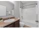 Well-lit bathroom features a shower-tub combo with modern fixtures and neutral finishes at 7418 61St E St, Palmetto, FL 34221