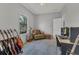 Bedroom has a window, chair, guitars, and built-in storage, perfect for hobbies or relaxation at 7418 61St E St, Palmetto, FL 34221