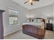 Neutral bedroom features a ceiling fan and natural light, creating a relaxing atmosphere at 7418 61St E St, Palmetto, FL 34221