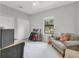 Bedroom has a window, chair, guitars, and built-in storage, perfect for hobbies or relaxation at 7418 61St E St, Palmetto, FL 34221