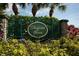 Entrance to a well maintained neighborhood community with mature plants and manicured lawns at 7418 61St E St, Palmetto, FL 34221