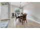 Cozy dining room with a chandelier, a window, and a wooden table with leather chairs at 7418 61St E St, Palmetto, FL 34221