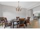 Comfortable dining room with a wood table set for six at 7418 61St E St, Palmetto, FL 34221