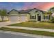 Charming single-story home with a well-manicured lawn and a three-car garage at 7418 61St E St, Palmetto, FL 34221