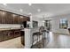 Modern kitchen with granite countertops, stainless steel appliances, and breakfast bar seating at 7418 61St E St, Palmetto, FL 34221
