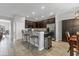 Modern kitchen with breakfast bar, stainless steel appliances, and view to the dining room at 7418 61St E St, Palmetto, FL 34221