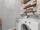 Functional laundry room with modern washer and dryer, ample storage, and convenient layout at 7418 61St E St, Palmetto, FL 34221