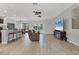 Open-concept living room with tile floors, modern furniture, and an entertainment center at 7418 61St E St, Palmetto, FL 34221
