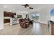 Open floorplan with living room featuring tile flooring, connecting to kitchen and dining areas at 7418 61St E St, Palmetto, FL 34221