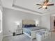 Serene main bedroom with tray ceilings, neutral colors, and stylish furnishings at 7418 61St E St, Palmetto, FL 34221