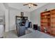 Cozy home office with a ceiling fan, a desk, and a built-in bookshelf at 7418 61St E St, Palmetto, FL 34221