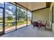 Cozy screened patio with comfortable seating, perfect for enjoying the outdoors year-round at 7418 61St E St, Palmetto, FL 34221