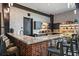 The bar area features quartz counters, brick accents, and stylish seating at 7743 Nightfall Ter, Sarasota, FL 34241