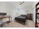 Cozy bedroom with large window letting in natural light and neutral carpeting at 7743 Nightfall Ter, Sarasota, FL 34241