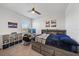 This bedroom has a car racing theme with a lake view from the window at 7743 Nightfall Ter, Sarasota, FL 34241