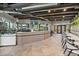 Community cafe featuring a counter with bar seating and a nearby gymnasium entrance at 7743 Nightfall Ter, Sarasota, FL 34241
