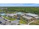 Aerial view of community center featuring pools, lounge areas, and modern architecture at 7743 Nightfall Ter, Sarasota, FL 34241