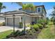 Charming two-story home with a well-manicured lawn and a two-car garage at 7743 Nightfall Ter, Sarasota, FL 34241