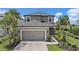 Charming two-story home featuring a two-car garage and beautifully landscaped front yard at 7743 Nightfall Ter, Sarasota, FL 34241