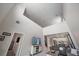 A bright, two-story living room is open to the kitchen and breakfast nook at 7743 Nightfall Ter, Sarasota, FL 34241
