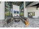 Welcoming lobby with comfortable seating, a fireplace, and large windows with natural light at 7743 Nightfall Ter, Sarasota, FL 34241