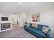 Bright loft space showcasing a comfortable seating area and seamless transition to the adjacent rooms at 7743 Nightfall Ter, Sarasota, FL 34241