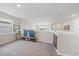 Upstairs loft featuring a TV and a window with a view of nature at 7743 Nightfall Ter, Sarasota, FL 34241