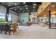 Spacious lounge area featuring comfortable seating, modern decor, and stylish lighting fixtures throughout the space at 7743 Nightfall Ter, Sarasota, FL 34241