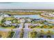An aerial view of the community clubhouse, pool, tennis courts, and lush landscaping in The Isles at Lakewood Ranch at 8195 Redonda Loop, Lakewood Ranch, FL 34202