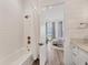 Bright bathroom leads into the bedroom with custom design and modern shower and fixtures at 8195 Redonda Loop, Lakewood Ranch, FL 34202