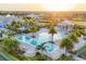 Aerial view of the resort-style community pool, cabana, and lounging areas perfect for relaxation at 8195 Redonda Loop, Lakewood Ranch, FL 34202