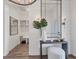 Welcoming entryway with shiplap walls, a large mirror, and stylish decor at 8195 Redonda Loop, Lakewood Ranch, FL 34202