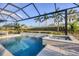 Soak up the Florida sun by this stunning pool with a built-in spa and screened-in lanai at 8195 Redonda Loop, Bradenton, FL 34202