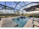 Enjoy the Florida sunshine in this pool and spa with waterfall feature and screened-in lanai at 8195 Redonda Loop, Lakewood Ranch, FL 34202