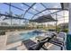 Enjoy the Florida sunshine in this pool and spa with an umbrella, tanning ledge, and screened-in lanai at 8195 Redonda Loop, Lakewood Ranch, FL 34202