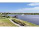 Picturesque walking path along the water with a fountain and views of the surrounding community at 8195 Redonda Loop, Lakewood Ranch, FL 34202