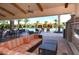 Covered pool patio area with comfortable seating and a view of the pool at 8713 Mangilli Rd, Sarasota, FL 34238