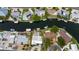 An aerial shot showing a neighborhood with waterfront homes and boats docked in the canals at 10108 Kingfisher E Rd, Bradenton, FL 34209