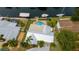Aerial view of a waterfront property featuring a pool, boat dock and canal access at 10108 Kingfisher E Rd, Bradenton, FL 34209