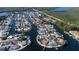 Aerial image of waterfront homes with boat docks on a canal with access to the bay at 10108 Kingfisher E Rd, Bradenton, FL 34209