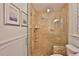 Shower featuring a glass-door, seat, and nozzle with a stone design at 10108 Kingfisher E Rd, Bradenton, FL 34209