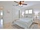 Bedroom with travertine flooring, ceiling fan, and sliding-door closet at 10108 Kingfisher E Rd, Bradenton, FL 34209