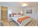 Bedroom with a white bedframe and a view of an ensuite and a closet at 10108 Kingfisher E Rd, Bradenton, FL 34209