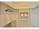 Neat, well-organized closet featuring hanging clothes and folded linen at 10108 Kingfisher E Rd, Bradenton, FL 34209