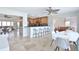 Open-concept kitchen with stainless steel appliances, bar seating, and adjacent dining area at 10108 Kingfisher E Rd, Bradenton, FL 34209