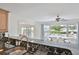 Modern kitchen featuring sleek countertops and a view of the inviting outdoor pool area at 10108 Kingfisher E Rd, Bradenton, FL 34209