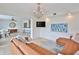 Living room with contemporary chandelier and an adjacent kitchen/dining area at 10108 Kingfisher E Rd, Bradenton, FL 34209