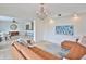 Living room with contemporary chandelier and an adjacent kitchen/dining area at 10108 Kingfisher E Rd, Bradenton, FL 34209