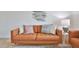 Cozy living room showcases comfortable seating with stylish accent pillows, decorative fish art, and a side table at 10108 Kingfisher E Rd, Bradenton, FL 34209